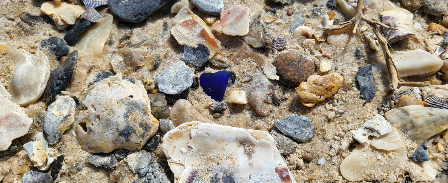 cobalt blue seaglass on sand